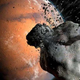 Imagen para el artículo titulado Las dos lunas de Marte en realidad son fragmentos de una luna mayor desaparecida, según un nuevo estudio